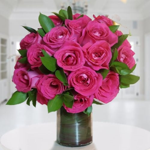 24 dark pink roses in vase