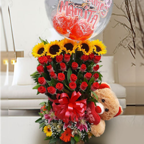 Arrangement of 24 red roses, sunflowers, gerberas, lilies with teddy bear and "Te amamos mamita" balloon, special for Mom