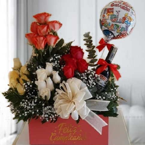 Mixed rose arrangement in yellow, salmon, red, and white with a Baileys bottle – perfect gift for delivery in Cali, Colombia.