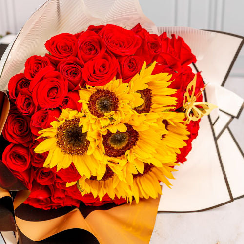 Special bouquet with 7 sunflowers, 65 red roses, custom ribbon, and Korean wrapping – delivery available across Colombia