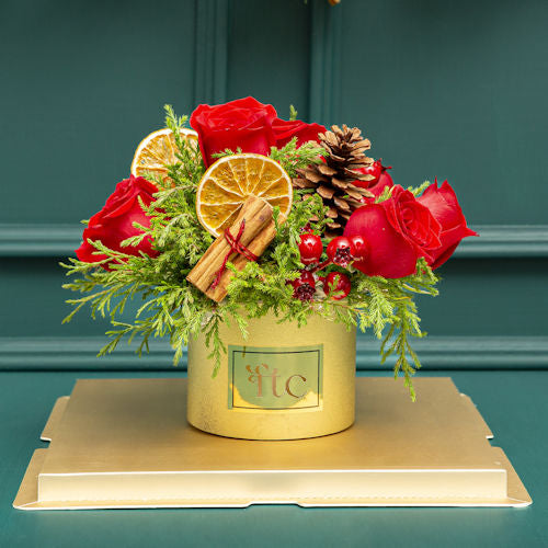 Elegant Christmas Centerpiece with Red Roses and Festive Accents