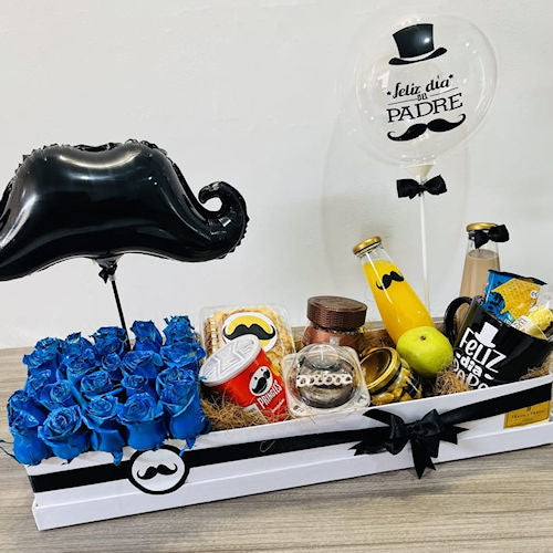 Luxury breakfast box with blue roses, baked cake, and gourmet treats, including customizable balloons