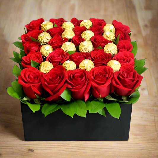 Luxurious arrangement of fresh red roses paired with Ferrero Rocher chocolates, presented in an elegant black box. Perfect for romantic occasions and same-day delivery in Cali.