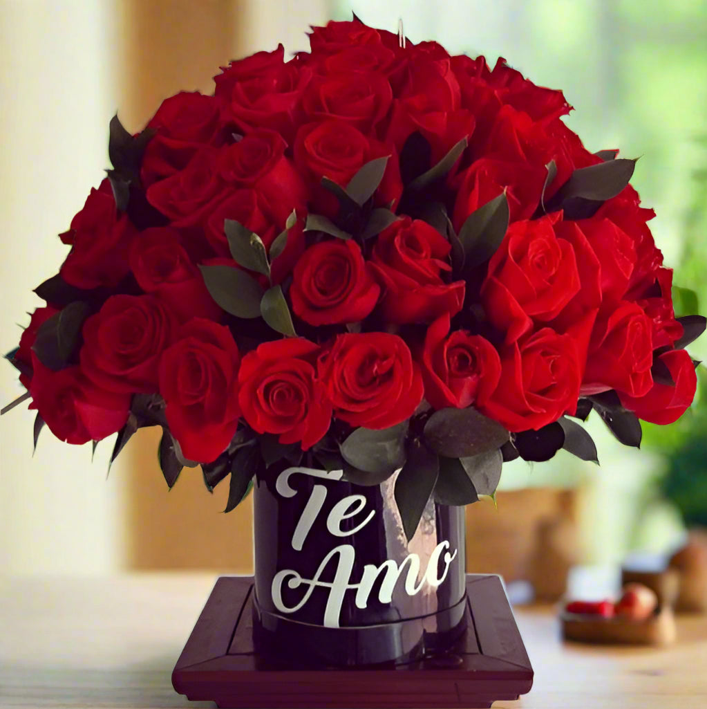 Elegant arrangement of fresh red roses in a black box with 'Te Amo' written in white. Perfect for romantic occasions with same-day delivery in Cali.